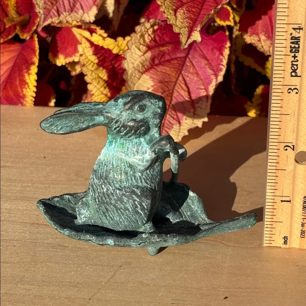 Vintage Bronze Rabbit Paddling A Leaf Boat